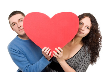 loving couple tenderly holding heart