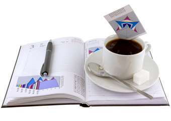 Coffee, standing on organizer, and  diagrams .Isolated.