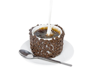 Splashes pour in milk into cup of coffee,decorate coffee beans.