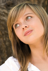 Fototapeta premium The beautiful young girl in park. Portrait