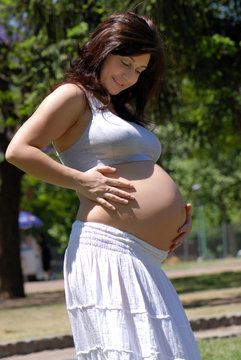 The pregnant woman in park