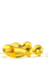 Fototapeta na wymiar yellow pills isolated in white background
