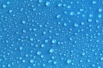 Water drops on a blue surface