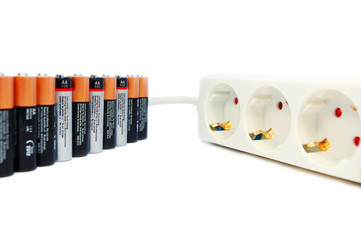 Batteries and power extension cord. Alternative energy concept.