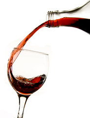 Pouring red wine in glass