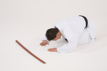 Bowing male in Karate uniform