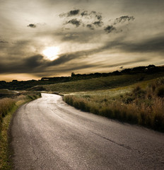 road in middle of rural area to evening