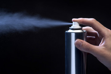 hand holding spraycan