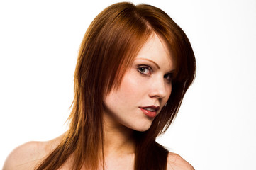 Fototapeta premium Beautiful young red haired woman isolated on a white background