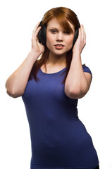 Beautiful young Redhead woman with headphones
