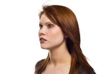 Fototapeta premium Beautiful young red haired woman isolated on a white background
