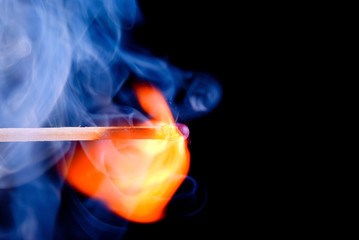 Burning match with blue smoke - Powered by Adobe