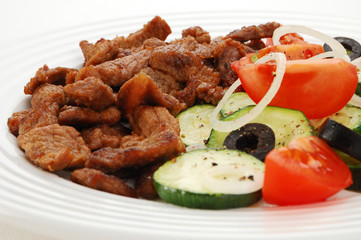 Grilled meat with vegetable salad