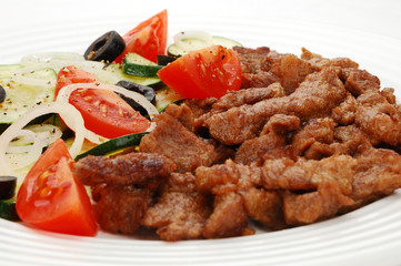 Grilled meat with vegetable salad