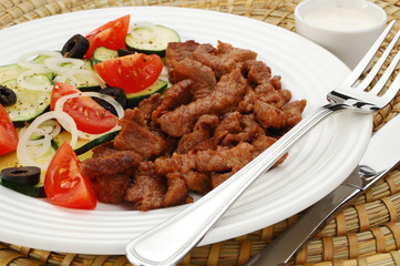 Grilled meat with vegetable salad