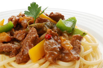 Pasta with meat and vegetables isolated on white background