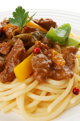 Pasta with meat and vegetables isolated on white background