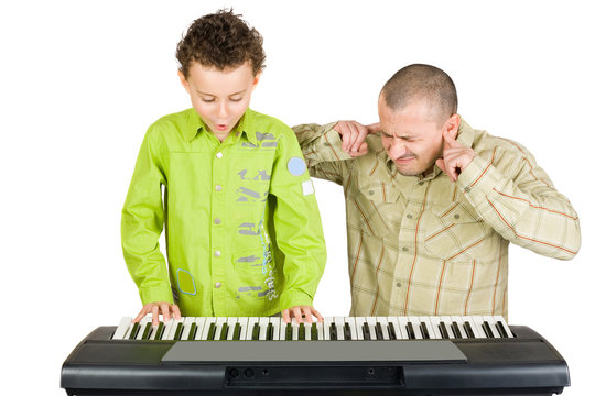 Kid playing piano badly