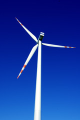 Wind turbine on blue sky