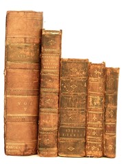 Stack of old books isolated by white