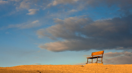 Sunlit Bench on a Hill in Death Valley