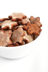 homemade star-shaped christmas cookies in a white bowl
