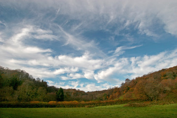 clouds over autumn meadow