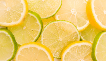 Fototapeta na wymiar Lemon and lime slices abstract background