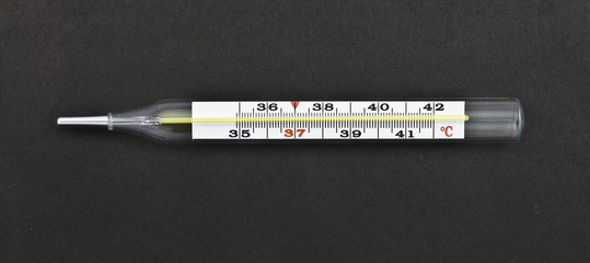 medical thermometer on a black background