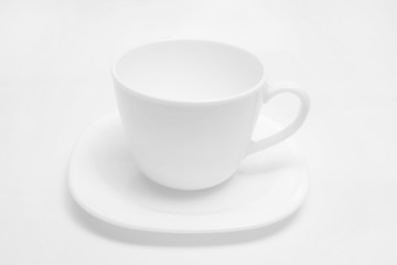 White cup on light background.