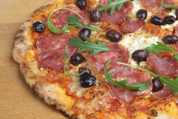 Pizza with Salami, Olives and Rocket