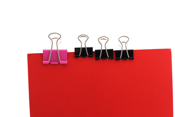 Paper clips on a red background