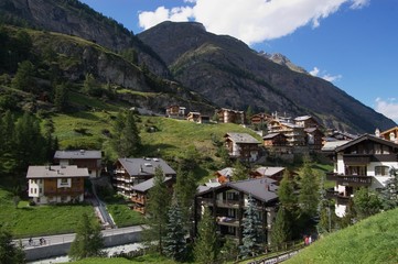 Fototapeta na wymiar hotels in mountain valley in switzerland