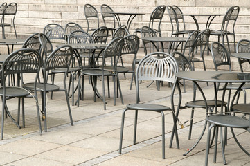 Empty street cafe in a cold and rainy summer