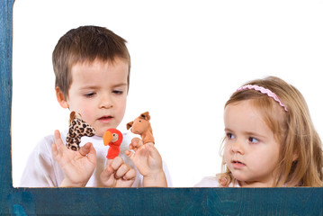 Children playing with puppets