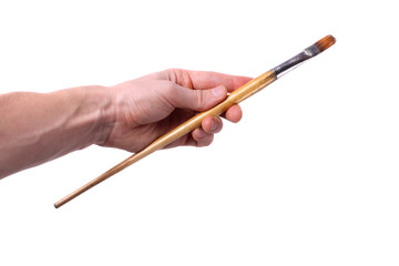 Hand holding paintbrush
