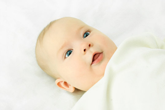 cute four months old baby with blue eyes