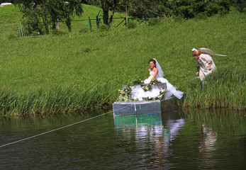 Wedding. The bride on a raft and an angel.
