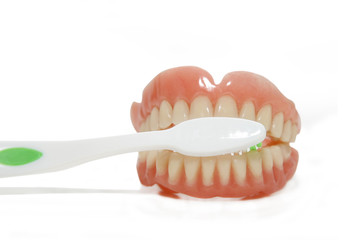 false teeth and toothbrush