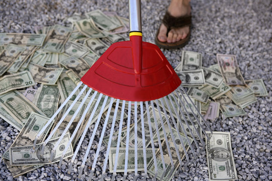 Money by the shovel full stock photo. Image of currency - 10656268