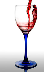 Red wine flowing to a glass. clipping path