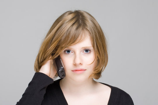 beautiful teen girl speaking on a radio phone