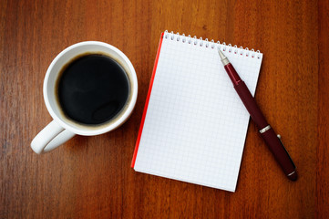 Notebook and coffee