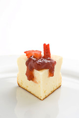 cheesecake with fresh strawberries and blackberry jam