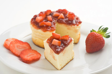 cheesecake with fresh strawberries and blackberry jam