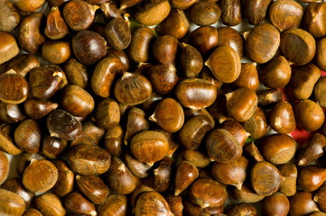 Many chestnuts arranged at the background