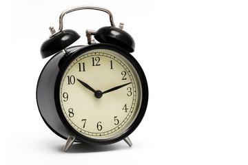 black clock with alarm bells on white background