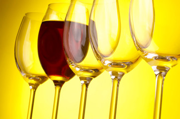Wine glasses on yeloow background