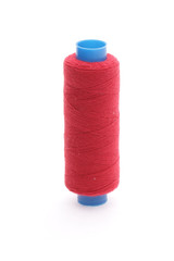 The coil of red threads on white background