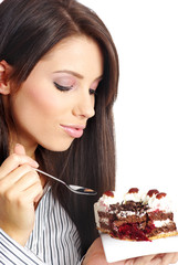 businesswoman wearing white shirt eating the cake.